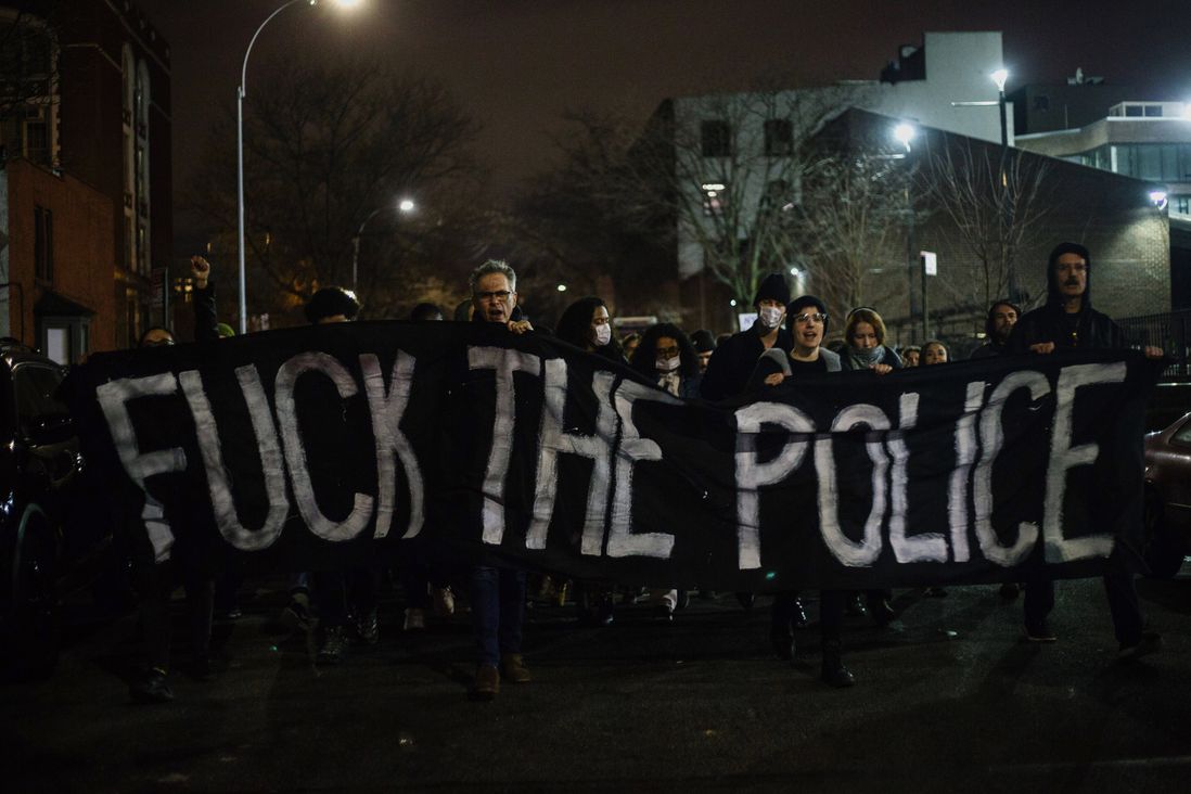 Protesters hold a banner on Friday night.